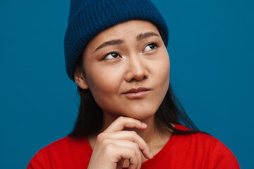 Portrait of a casual young asian woman standing