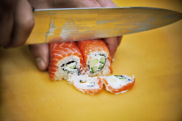 Chef preparing sushi. Close up.