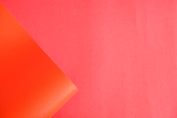 Orange cardboard on a red background. The texture of the cardboard.
