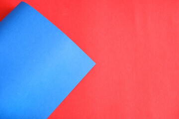 Blue cardboard on a red background.