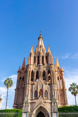 Fototapeta premium Looking up at the Archangel Parish of San Miguel under blue sky