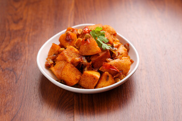 Masala Idli or Masala idly coconut chutney green chutney popular breakfast of Kerala Tamil Nadu South India and Sri Lanka. Healthy steamed rice cakes steaming fermented batter of black lentils , rice.