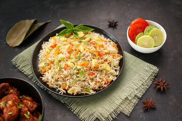 Chinese fried rice and chilly chicken curry Chicken fried rice with vegetables fried eggs basmati grain very popular food in restaurants Kerala Mumbai India Sri Lanka china