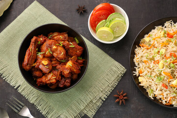 Chilli chicken curry, chicken manchurian Mumbai, Delhi India Sri Lanka china. Top view popular North Indian meat side dish of Chapati, Roti, Naan, Paratha, fried rice, Indo Chinese cuisine restaurant