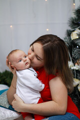 New Year's photos of mom and baby. little baby with mom for new year
