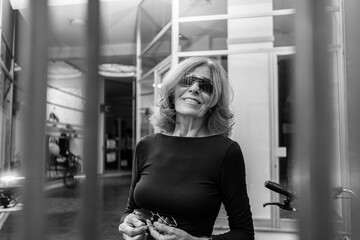 senior woman wearing blu shirt and sunglasses