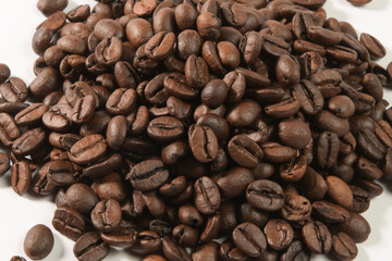 Roasted coffee beans isolated on white background.