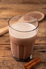 Glass with chocolate on the table.