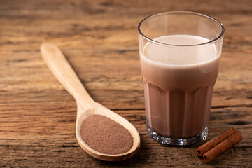 Glass with chocolate on the table.