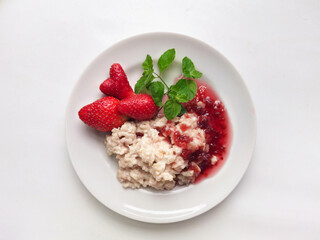 oatmeal porridge with strawberries and jam