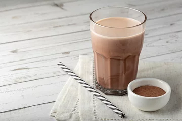 Fotobehang Chocolade Glass with chocolate on the table.  © WS Studio