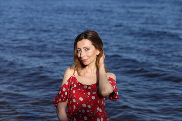 Portrait of beautiful woman in red dress