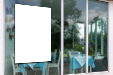 large blank billboard mounted on a restaurant glass