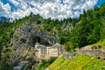 Predjama castle Slovenia the castle is a cave on a rock in HDR - 444019979