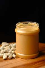  peanut butter in a container isolated on black 