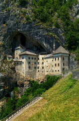 Fototapeta na wymiar Predjama castle Slovenia the castle is a cave on a rock in HDR