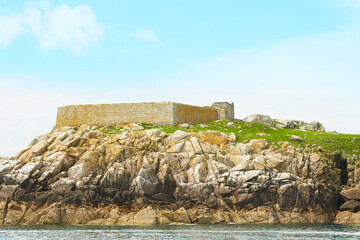 Blue sky and sunny day with Fort, Martello tower, Saint Begnet's Church on Dalkey Island, County...