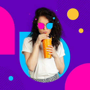Creative image, art collage. Portrait of young caucasian girl in multicolored glasses with paper cup over purple background.