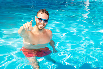 young man has fun in the pool