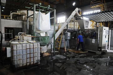 Almaty, Kazakhstan - 07.01.2016 : Workers are engaged in recycling waste paper and making cardboard.