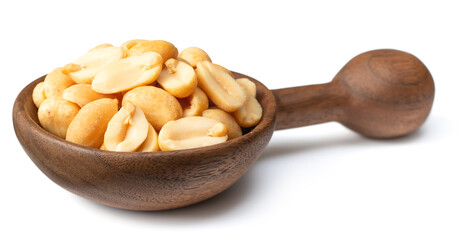 roasted peanuts in the wooden spoon, isolated on white background