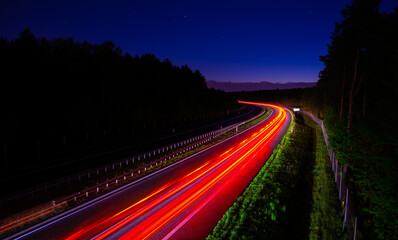 Fototapeta na wymiar Night road lights. Lights of moving cars at night. long exposure