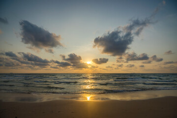 Fototapeta na wymiar Bubble waves and morning sun at the southern sea, Thailand