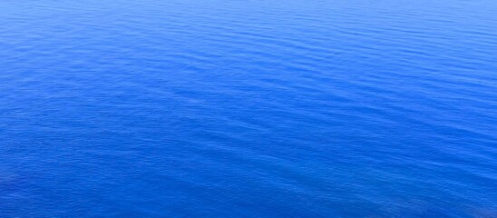 Obraz premium Blue sea water surface. Beautiful blue sea calm background.