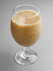 Delicious cold kiwi smoothie in glass