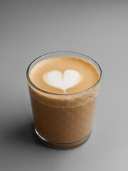 Flat white with a beautiful latte art in a glass