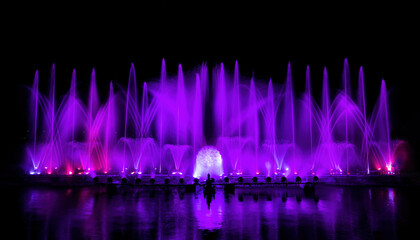 The colorful fountain dancing in celebration of year with dark night sky background