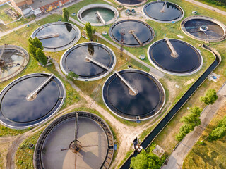 Round polls in wastewater treatment plant, filtration of dirty or sewage water. Aerial view