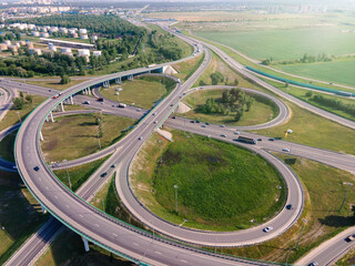 Aerial view highway interchange multiple road interchanges. Traffic cars driving on a motorway