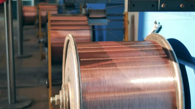 Rotating reels with copper wire on them