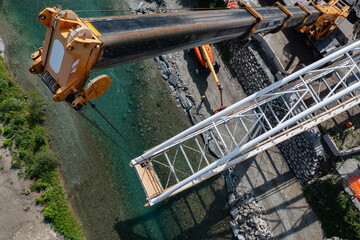Sondrio, Italy, launch of a steel bridge over the Mallero stream, aerial view