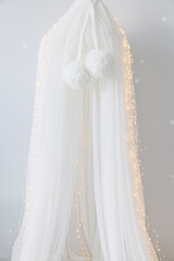 Interior of children bedroom with white canopy