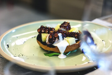 Octopus appetizer with potatoes and fondue