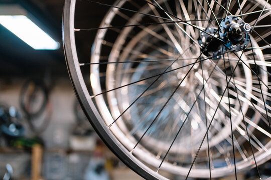 Bicycle wheels on rack in workshop
