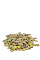 Coins of different countries and different denominations on a white background