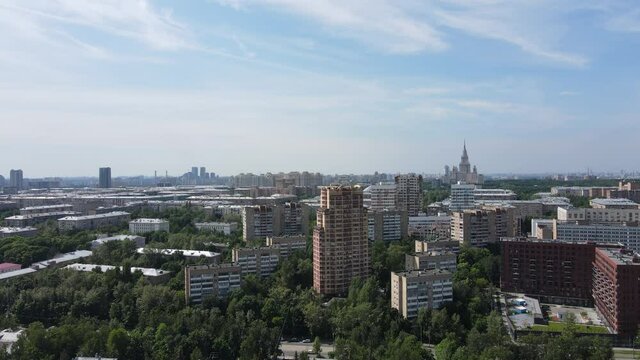 Aerial view of skyscraper and residential buildings in Moscow city center and Moscow State University.4K