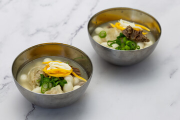 Korean style rice cake soup which is called Jolaeng-i Ddukkuk eats on the Lunar moon new year
