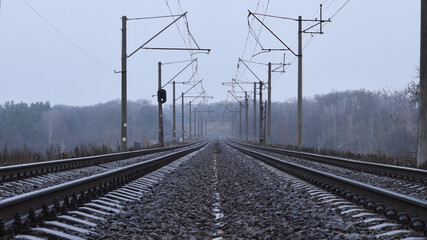 the railway goes into the distance, the rails are sleepers. branch of the high-speed railway. mirror surface of the rails. concept of travel, business trip, tourism, long journey