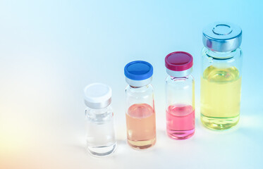 Four vials with different vaccines against the virus