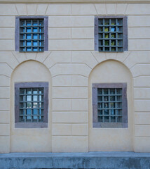 Façade of an old house with windows behind bars in Stockholm