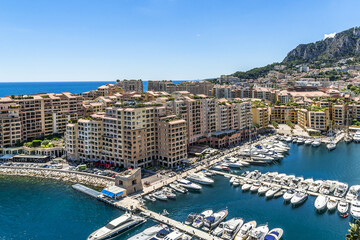 Fontvieille - district of Monaco vith boats and a high-rise apartment complex. Principality of Monaco is a sovereign city-state, located on the French Riviera in Western Europe. 