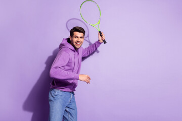 Photo portrait man playing tennis in hoody on court isolated pastel violet color background
