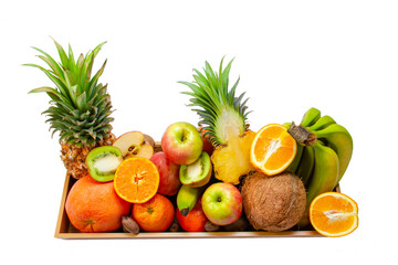 Set of fresh exotic fruits in a wooden tray on a white isolated background. Healthy food concept.