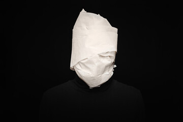 Man head wrapped in toilet paper