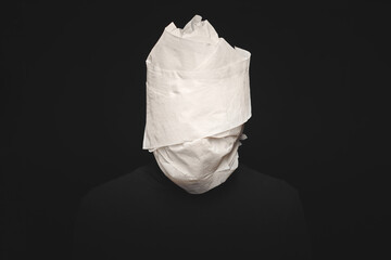 Man head wrapped in toilet paper