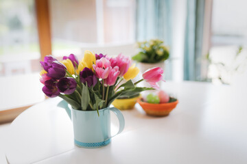 Fototapeta na wymiar Bunch of spring tulips flowers with easter eggs